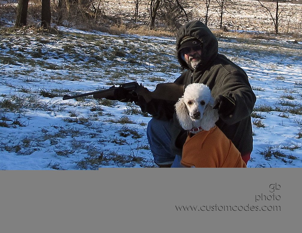 man_dog_and_gun